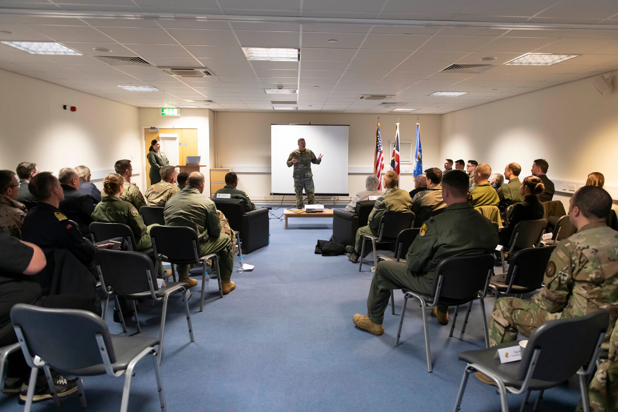 U.S. Air Force Col. Brian Filler, center, 501st Combat Support Wing commander, welcomes distinguished visitors to RAF Fairford, England, Feb. 21, 2022. The tour these dignitaries and guests were on was meant to give representatives from allied nations insights into the capabilities and operations of U.S. Air Forces in the United Kingdom. (U.S. Air Force photo by Senior Airman Jennifer Zima)