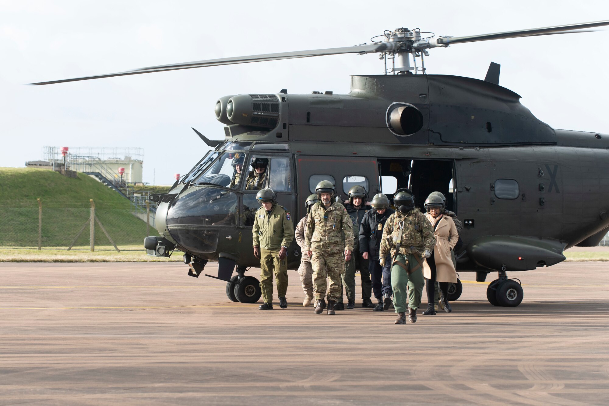 Distinguished dignitaries and guests from the U.S. Embassy-London arrive at RAF Fairford, England, Feb. 21, 2022. The tour these dignitaries and guests were on was meant to give representatives from allied nations insights into the capabilities and operations of U.S. Air Forces in the United Kingdom. (U.S. Air Force photo by Senior Airman Jennifer Zima)