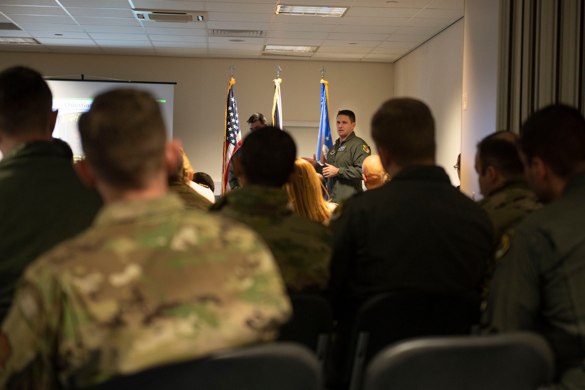 U.S. Air Force Lt. Col. Jeremy Stover, center left, 420th Air Base Squadron and 420th Expeditionary Air Base Squadron commander, center, briefs members of the Defense Academy of the United Kingdom about the ongoing operations at RAF Fairford, England, Feb. 22, 2022. The members of the Defense Academy of the United Kingdom were at Fairford to learn about the capabilities of the B-52, as well as the ongoing operations, including the Bomber Task Force, at Fairford.(U.S. Air Force photo by Senior Airman Jason W. Cochran)