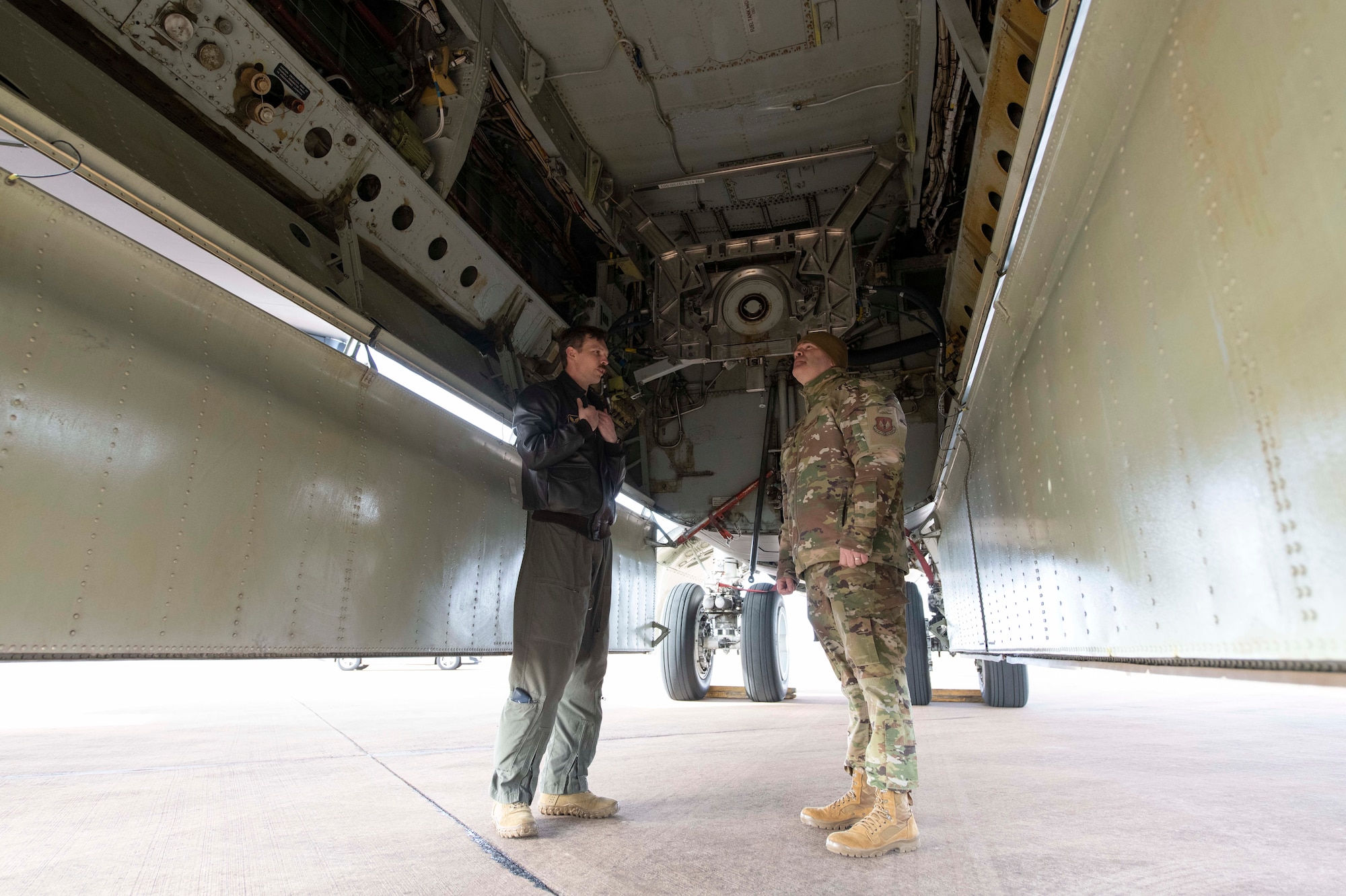 A U.S. Air Force B-52H Stratofortress pilot, left, assigned to the 69th Expeditionary Bomb Squadron, conducts an aircraft inspection with Col. Brian Filler, right, 501st Combat Support Wing commander, at RAF Fairford, England, Feb. 21, 2022. Filler completed several pre-flight requirements prior to boarding a B-52H Stratofortress for a familiarization flight. (U.S. Air Force photo by Senior Airman Jennifer Zima)