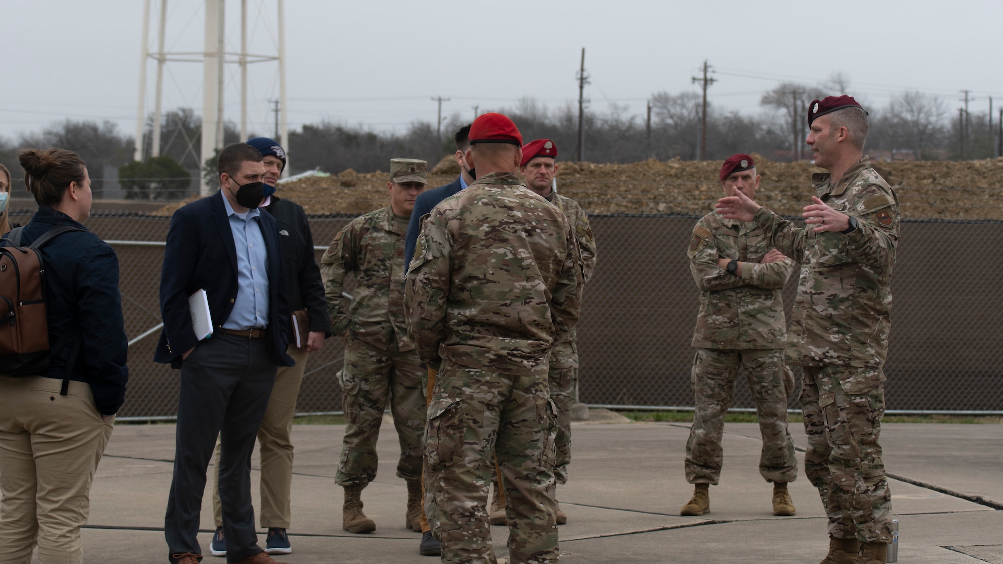 Chief Master Sgt. Todd Popovic (far right), Special Warfare Training Wing command chief, briefs a delegation of U.S. Senate staff members from across the United States on the significance of the SWTW memorial site overlooking the construction site of a new, $66.6M aquatics training facility that will accommodate training for over 3,000 Air Force Special Warfare trainees annually when complete on Joint Base San Antonio-Chapman Training Annex, Texas, Feb. 23, 2022.. The delegation visited the Special Warfare Training Wing to learn more about Air Force Special Warfare and the unique capabilities  AFSPECWAR operators bring to the battlefield.