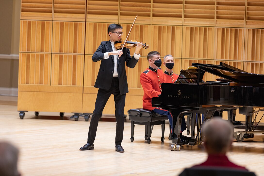 First place winner Henry Auxenfans of Chicago, IL, performs Felix Mendelssohn's Allegro molto appassionato from Violin Concerto in E minor, Opus 64 during the 2022 United States Marine Band Concerto Competition Finals.

(U.S. Marine Corps photo by Staff Sgt. Chase Baran/Released)