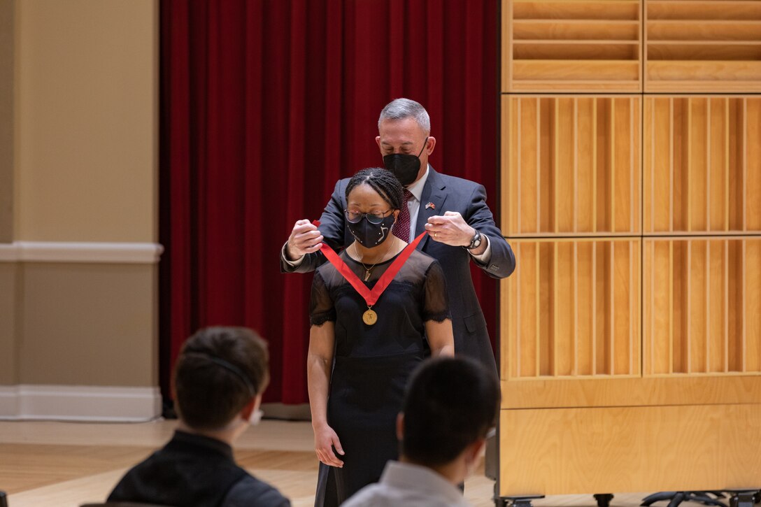 Concerto Competition third place winner Olivia Tilley receives a medal from MajGen James Lukeman USMC (Ret), President and CEO of the Marine Corps Heritage Foundation. Olivia will also receive a $500 scholarship from the Marine Corps Heritage Foundation.

(U.S. Marine Corps photo by Staff Sgt. Chase Baran/Released)