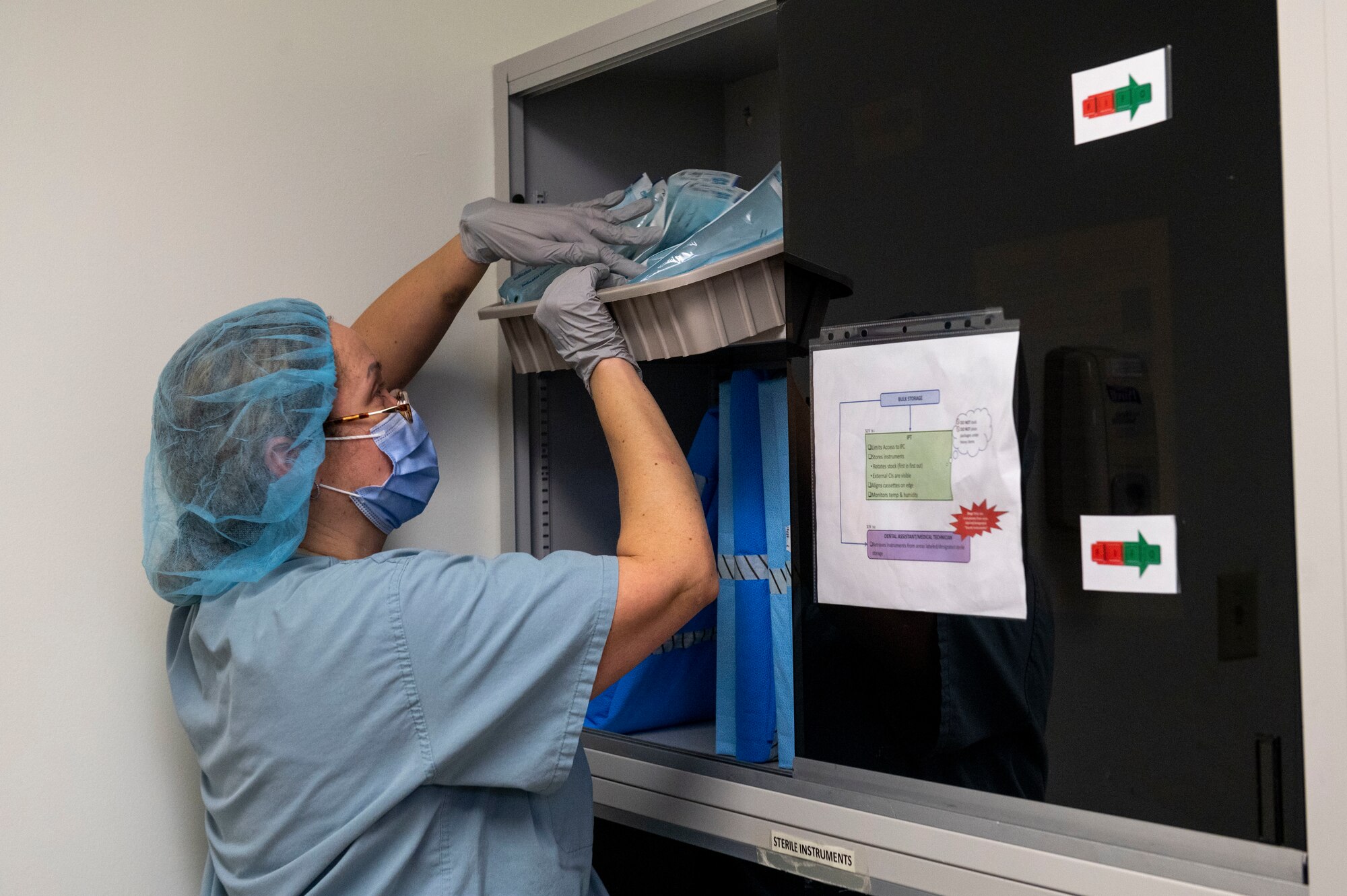 Tabitha Womack, 4th Operational Medical Readiness Squadron dental assistant, stores instruments at Seymour Johnson Air Force Base, North Carolina, Feb. 24, 2022. Womack stores cleaned instruments in a humidity and temperature controlled shelf to insure instruments are sanitary when used. (U.S. Air Force photo by Airman 1st Class Kevin Holloway)