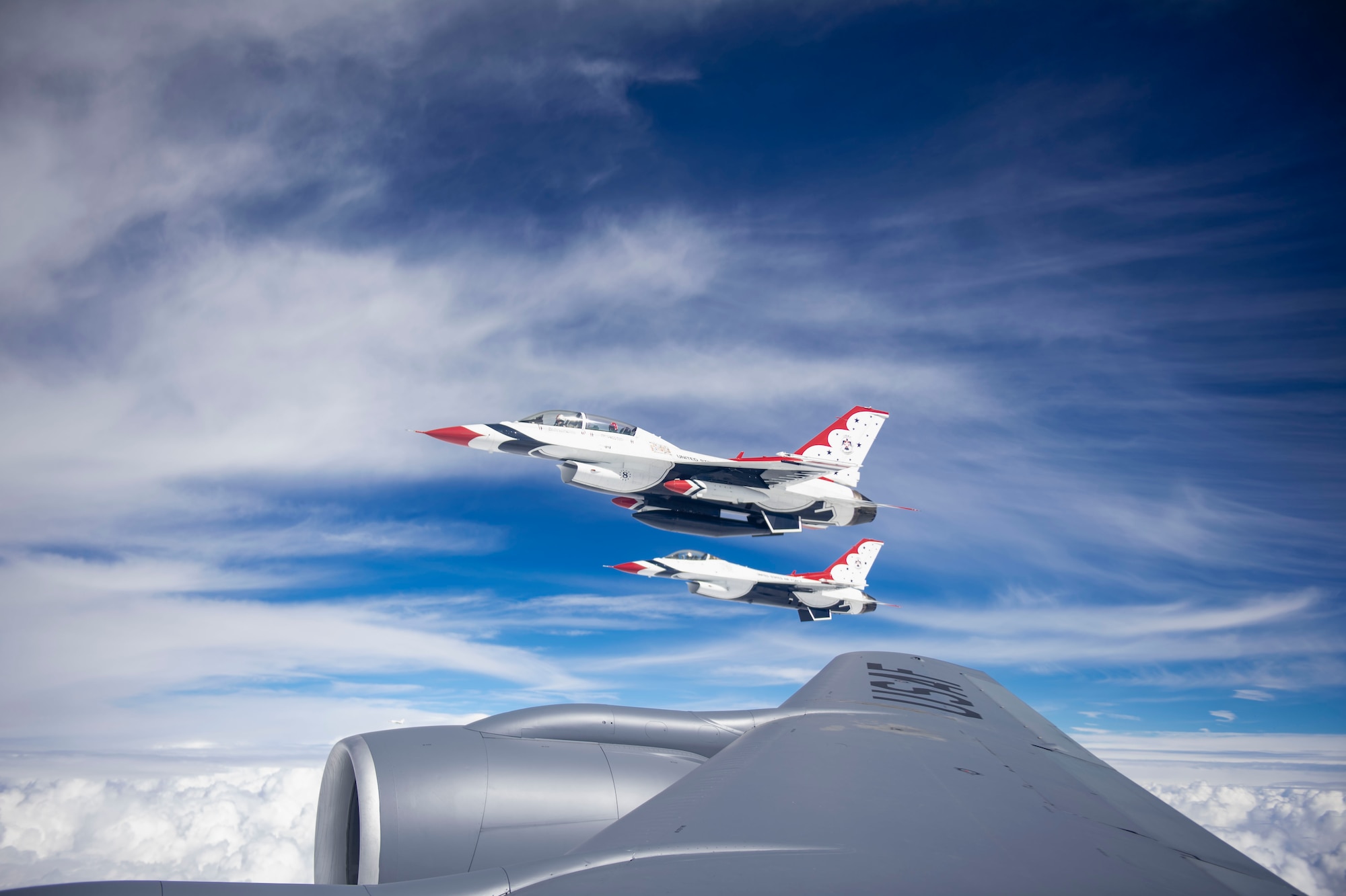 U.S. Air Force Demonstration Squadron “Thunderbirds” fly alongside a KC-135 Stratotanker assigned to MacDill Air Force Base, Florida, over New Mexico, Feb. 22, 2022.