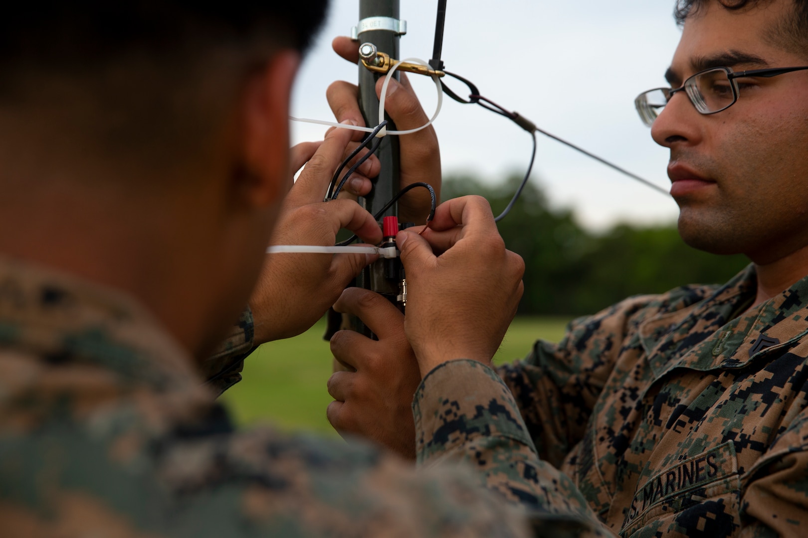 U.S. Marine transmissions system operators with 10th Marine Regiment, 2d Marine Division (MARDIV), set up a Dipole antenna as part of the 2d MARDIV High-Frequency (HF) Competition at Camp Pendleton, Va., July 13, 2021. The competition enhanced HF transmission proficiency and capabilities to prepare Marines for future expeditionary conflicts where the area is either contested or degraded. (U.S. Marine Corps photo by Pfc. Sarah Pysher)