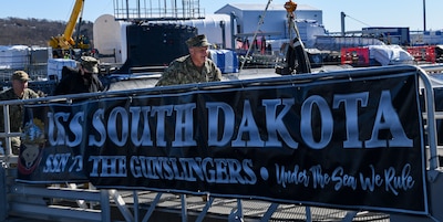 GROTON, Conn. (Feb. 28, 2022) Chief of Naval Operations (CNO) Adm. Mike Gilday departs the Virginia-class fast-attack submarine USS South Dakota (SSN 790), after a tour. Gilday and Rep. Joe Courtney, of Connecticut’s 2nd Congressional District, visited the Naval Submarine Base New London waterfront and Naval Submarine School after touring nearby General Dynamics Electric Boat Shipyard submarine construction facilities. (U.S Navy photo by Mass Communication Specialist 3rd Class Maxwell Higgins)