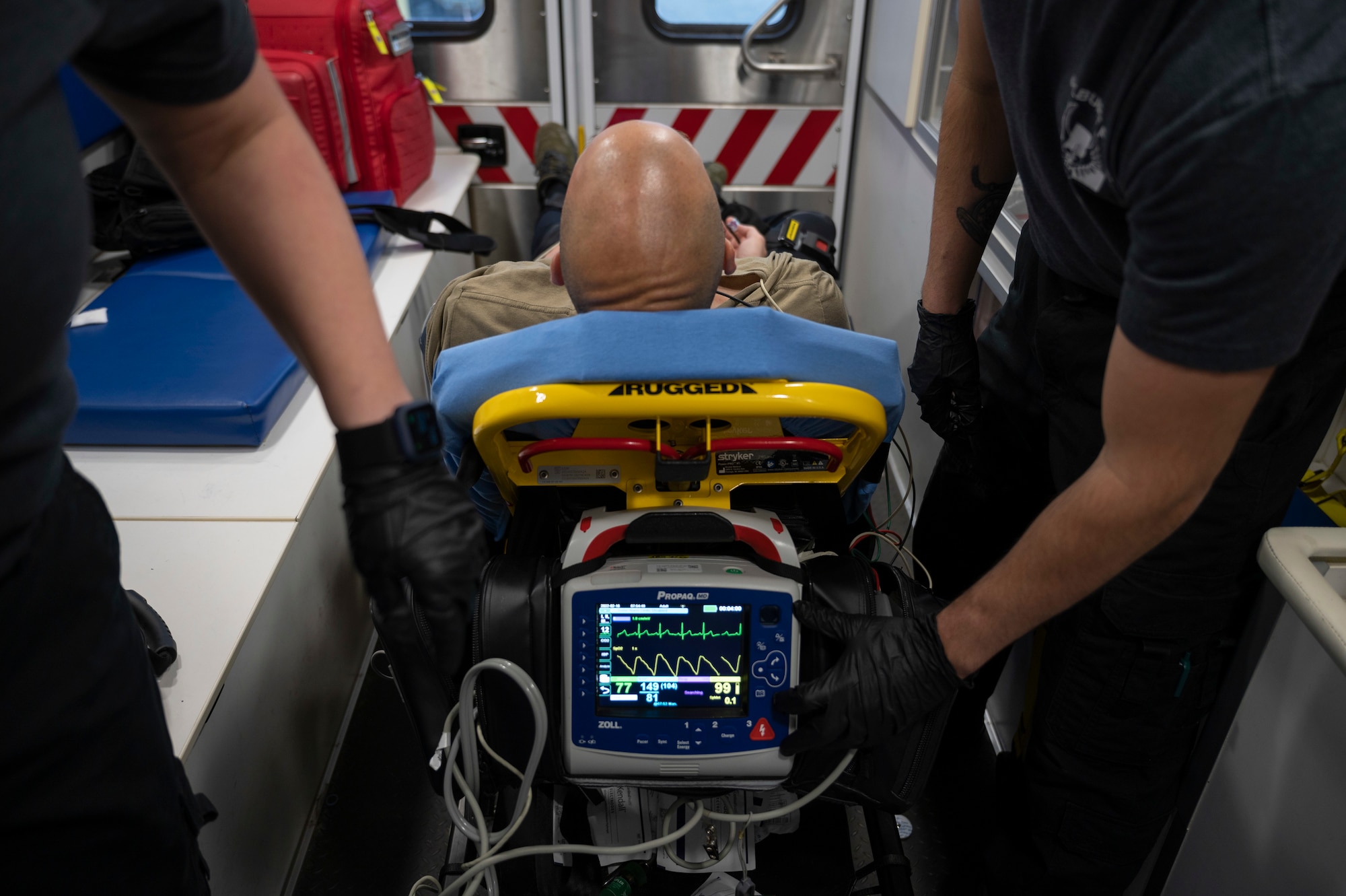 U.S. Air Force Staff Sgt. Erica Crowder, left, a 1st Special Operations Medical Group paramedic, and U.S. Air Force Staff Sgt. James Albright, right, a 1st SOMDG EMT, check the vitals of a patient during a call February 16, 2022, at Hurlburt Field, Florida.