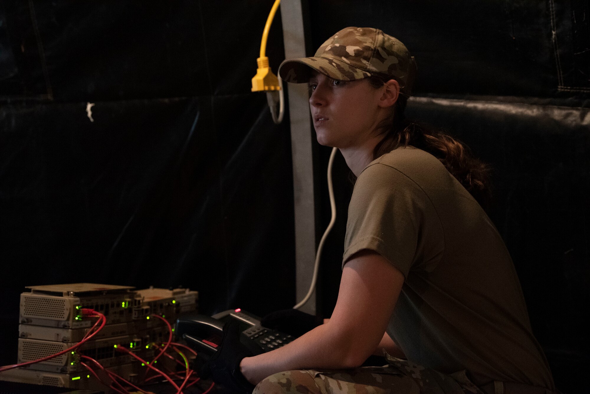An Airman sets up communications equipment