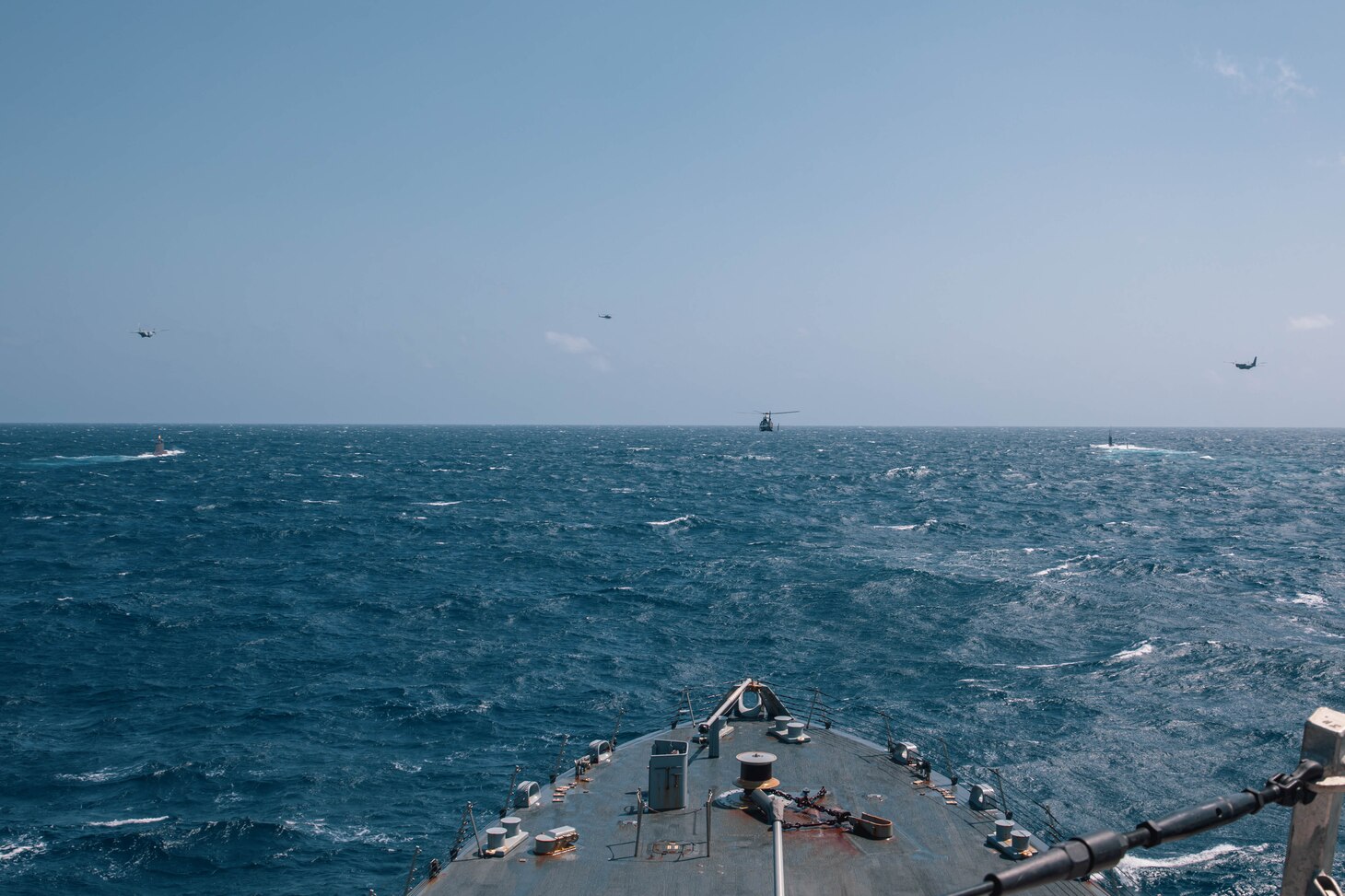 The Freedom-variant littoral combat ship USS Billings (LCS 15) sails in formation with the Virginia-class fast attack submarine USS Minnesota (SSN 783), the Colombian navy submarine ARC Pijao (SSK-28), Colombian navy Dauphin helicopters, and Colombian navy maritime patrol aircraft during a bilateral anti-submarine warfare exercise, Feb. 27, 2022. Billings is deployed to the U.S. 4th Fleet area of operations to support Joint Interagency Task Force South’s mission, which includes counter-illicit drug trafficking missions in the Caribbean and Eastern Pacific. (U.S. Navy photo by Mass Communication Specialist 3rd Class Aaron Lau/Released)