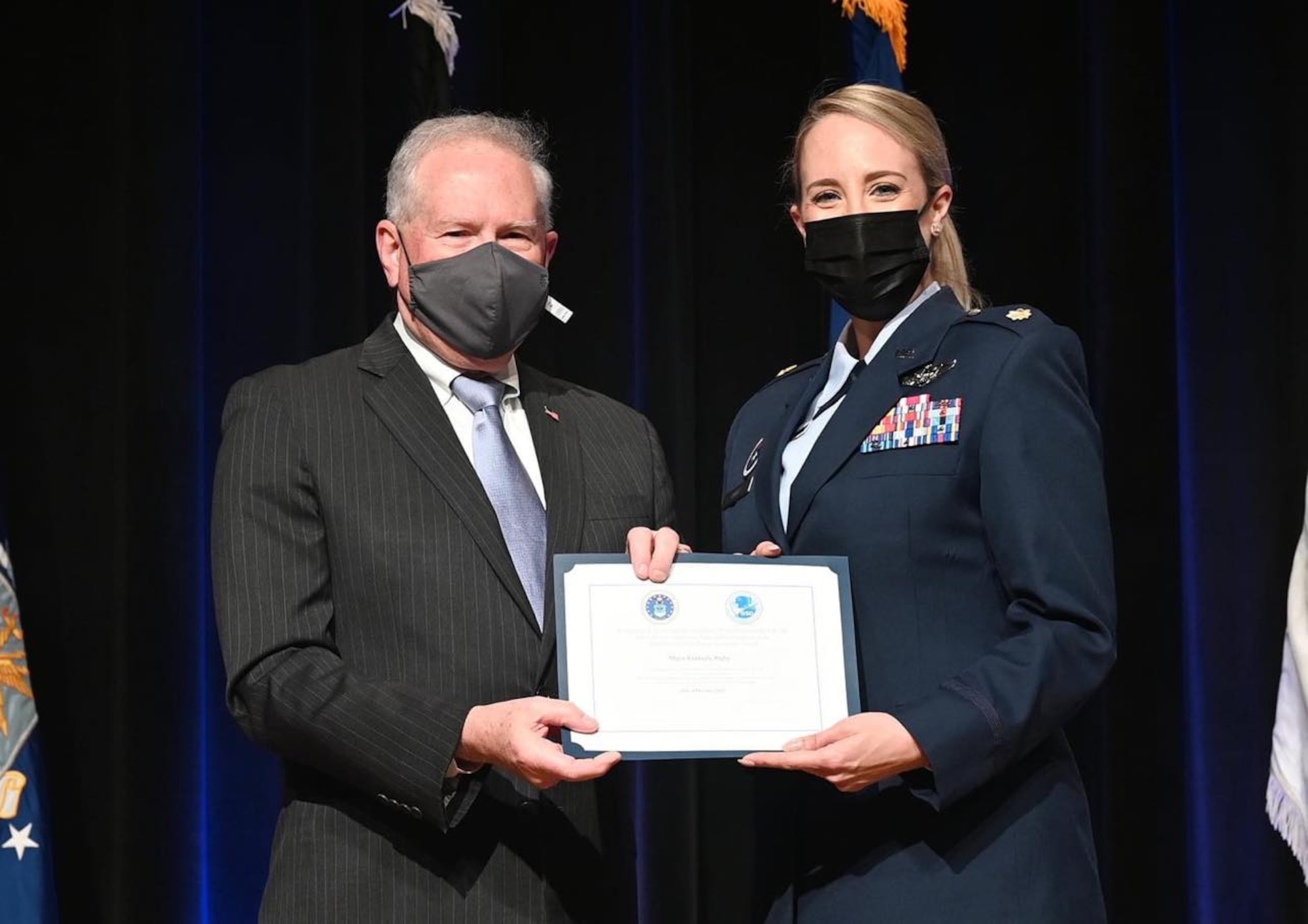 Secretary of the Air Force Frank Kendall, left, recognizes Maj Kim Rigby, deputy chief of staff of Air Force Global Strike Command, for her achievements as part of the Air Force Women’s Initiative Team at the Pentagon in Arlington, Virginia, October 2020. The WIT earned the Department of the Air Force Diversity and Inclusion Team Innovation Award for going above and beyond with efforts that advocate for diversity and inclusion in the Air Force.