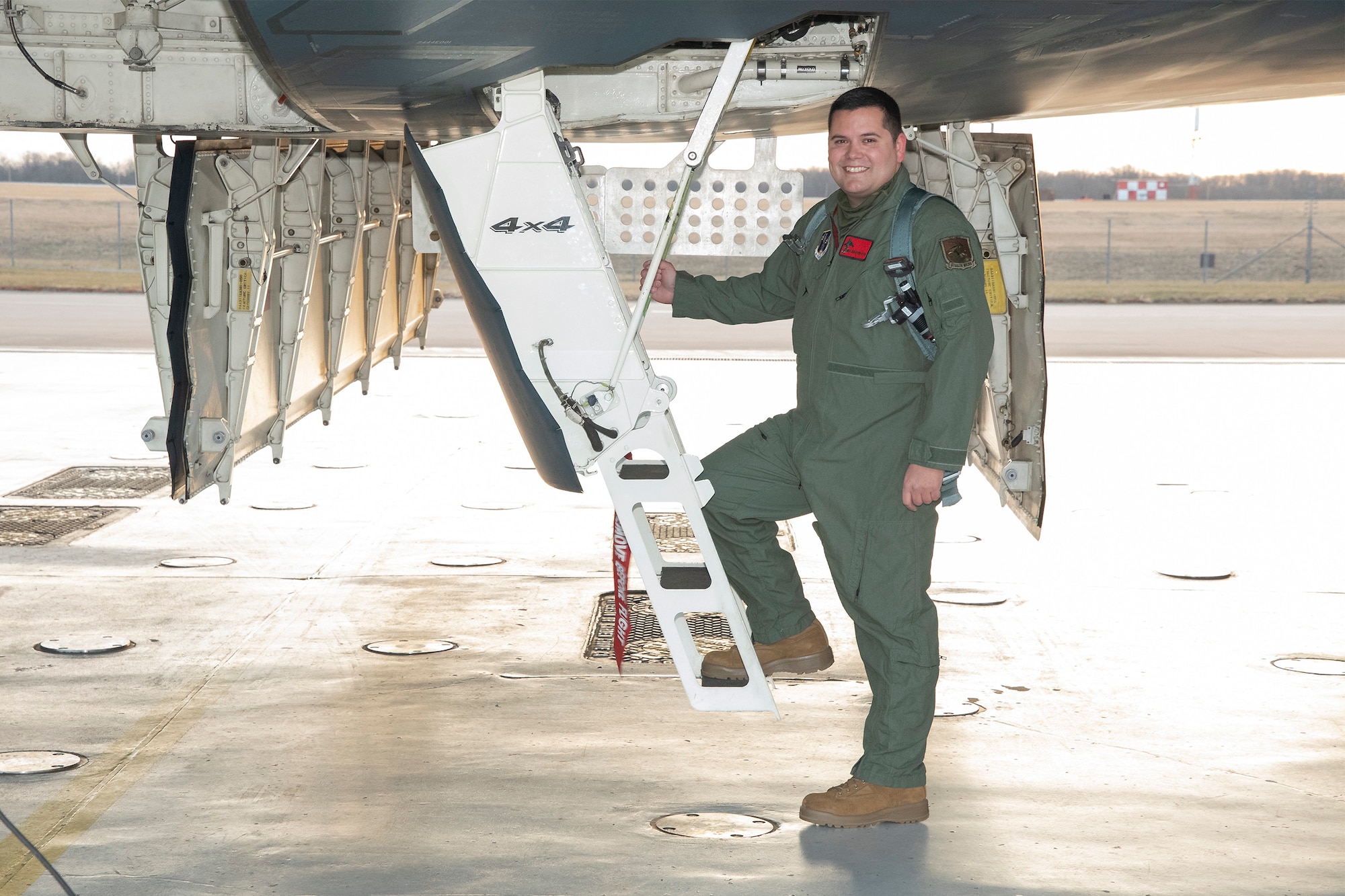 Master Sgt. Joshua Upton, the 131st Bomb Wing's Maintainer of the Year, poses for a photo before an incentive flight in a B-2 Spirit stealth bomber, Jan. 27, 2022, at Whiteman Air Force Base, Missouri. As a dedicated crew chief for Spirit 88-0329, Upton took primary responsibility for ensuring the aircraft was ready to conduct operations anytime, anywhere. (U.S. Air National Guard photo, 131st Bomb Wing Public Affairs)