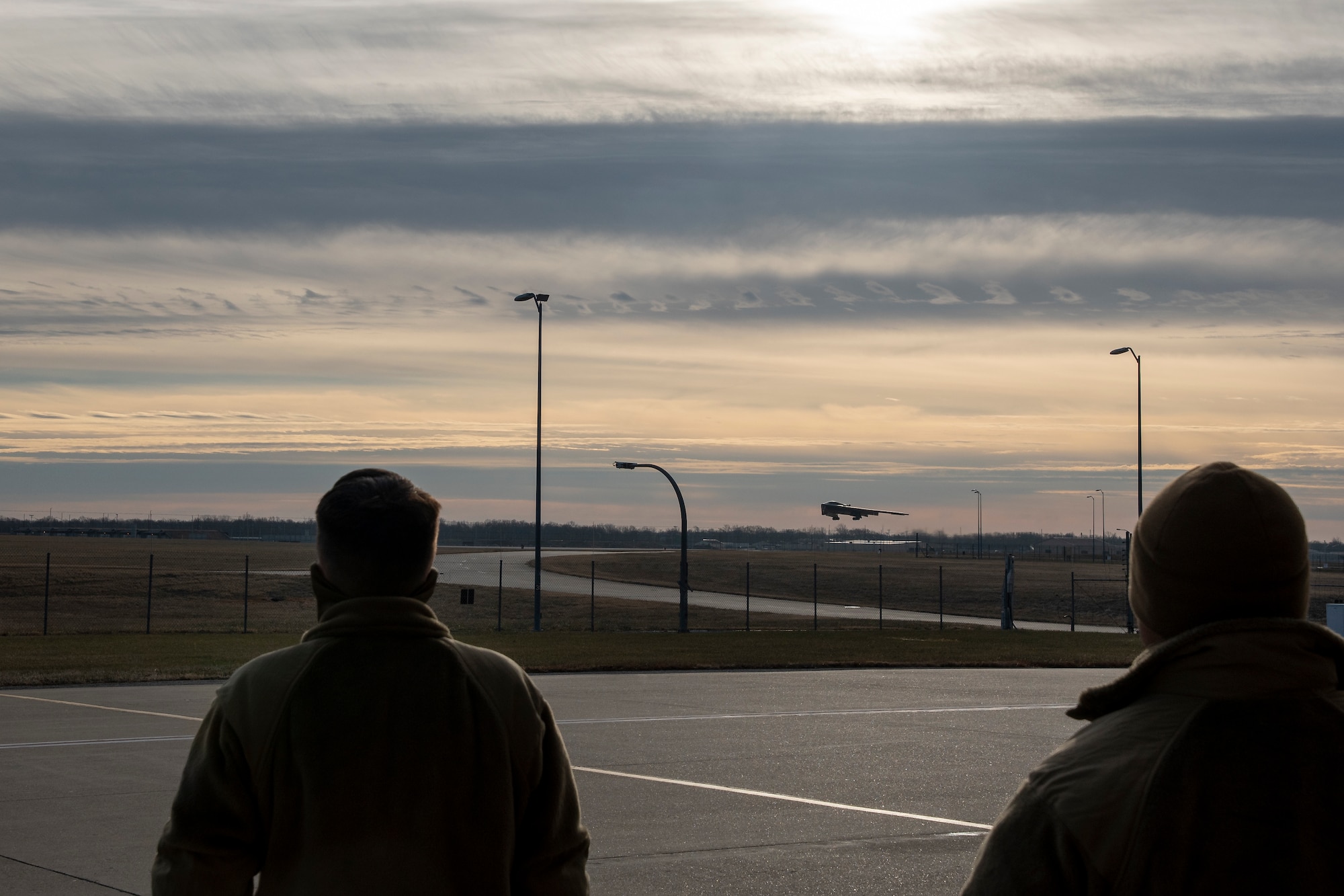 Master Sgt. Joshua Upton takes off in a B-2 Spirit stealth bomber at Whiteman Air Force Base, Missouri, Jan 9, 2022, as 131st Bomb Wing Airmen look on.  Upton, the wing's Maintainer of the Year, earned an inventive ride in the aircraft due to his exemplary work throughout 2021. (U.S. Air National Guard photo, 131st Bomb Wing Public Affairs)