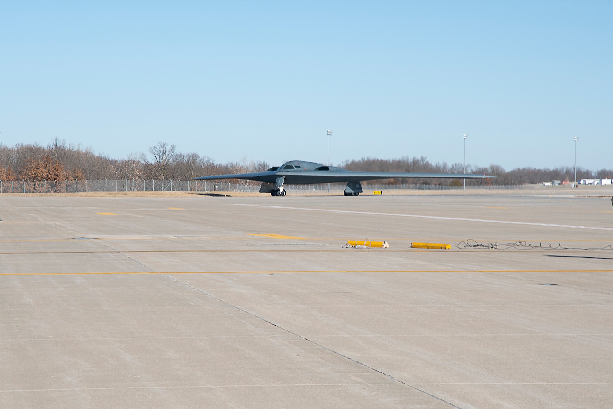Master Sgt. Joshua Upton taxies on the tarmac in a B-2 Spirit stealth bomber at Whiteman Air Force Base, Missouri, Jan 9, 2022. Upton, the wing's Maintainer of the Year, earned an inventive ride in the aircraft due to his exemplary work throughout 2021. (U.S. Air National Guard photo, 131st Bomb Wing Public Affairs)