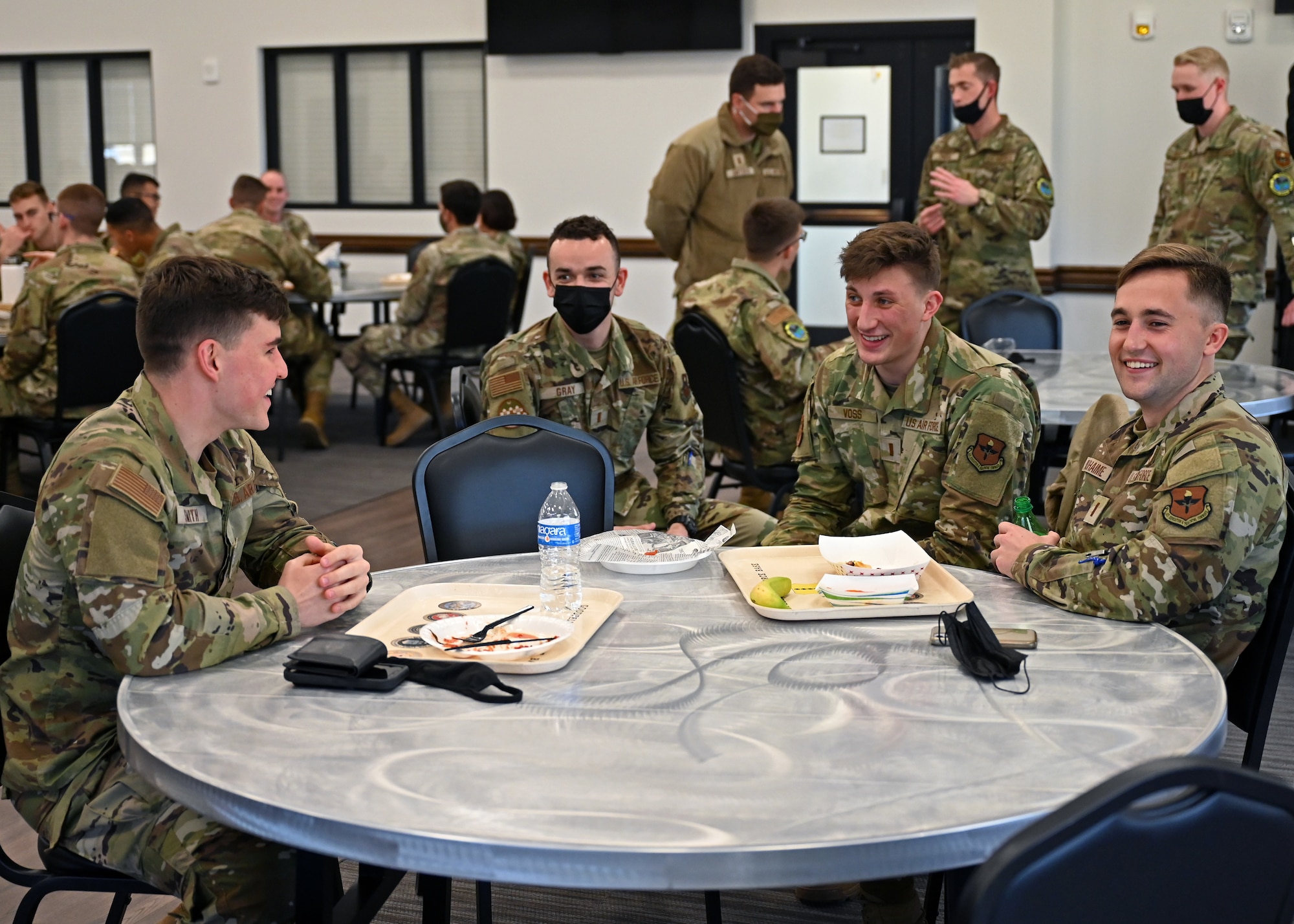 A Texas A&M University cadet, left, talks with 17th Training Wing lieutenants during lunch at the Cressman Dining Facility at Goodfellow Air Force Base, Texas, Feb. 18, 2022. Several of Goodfellow’s company grade officers met with the cadets to share experiences at Goodfellow, as well as tips and tricks for becoming an officer and transitioning to military life. (U.S. Air Force photo by Senior Airman Ethan Sherwood)