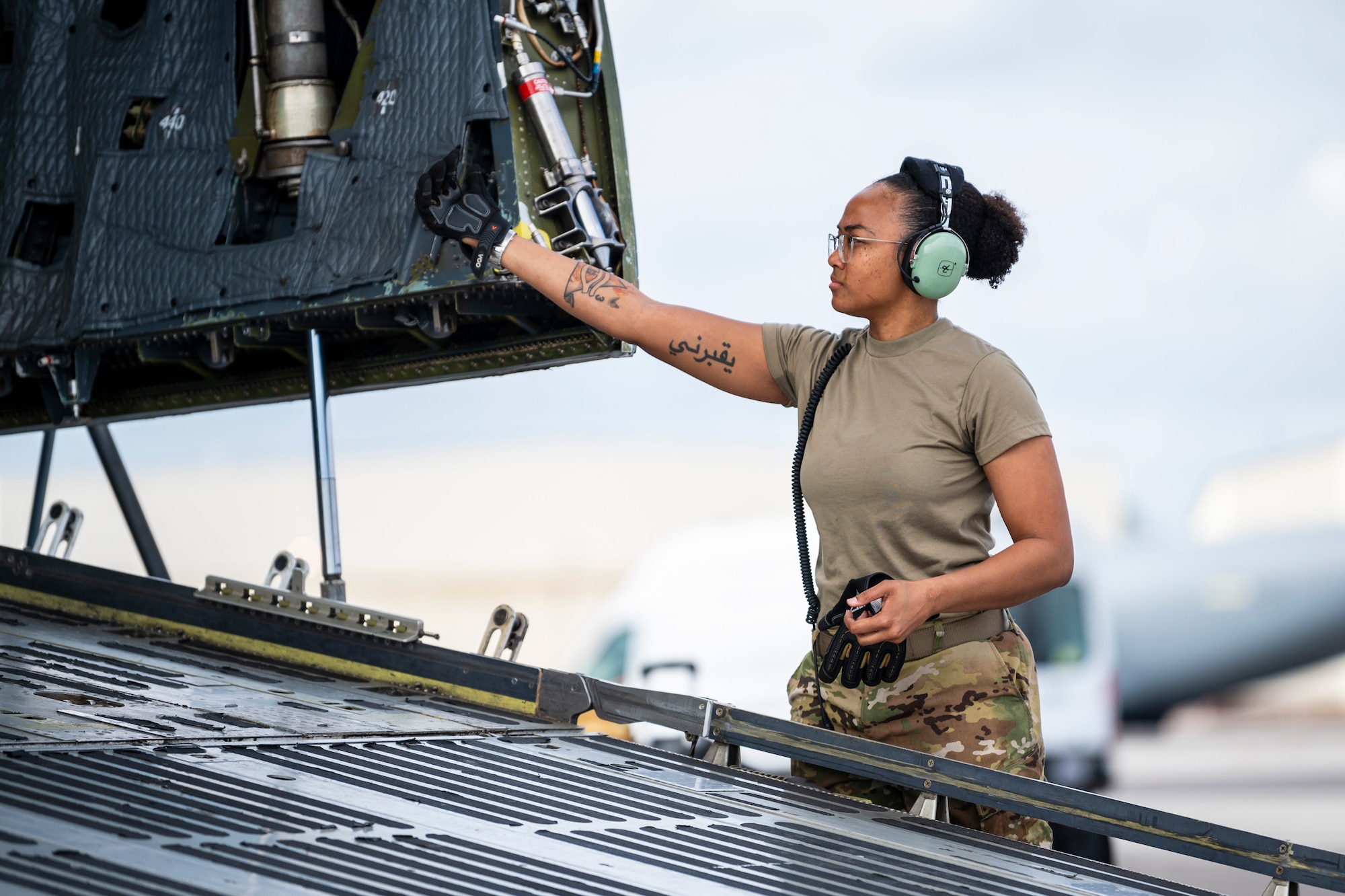 An Airman waves her hand