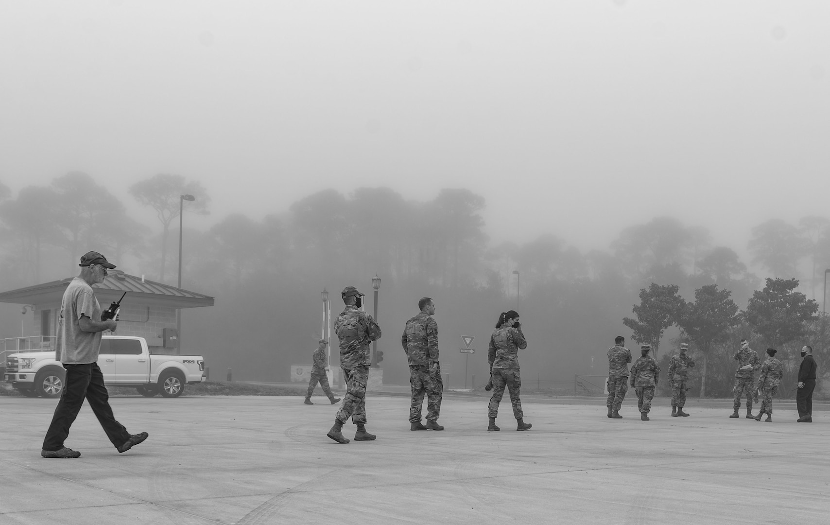 Members of the 1st Special Operations Wing, TK&K Services and Defense Logistics Agency Energy evacuate the hazardous zone of a fuel spill during a spill prevention and response exercise Feb. 24, 2022, at Hurlburt Field, Florida.