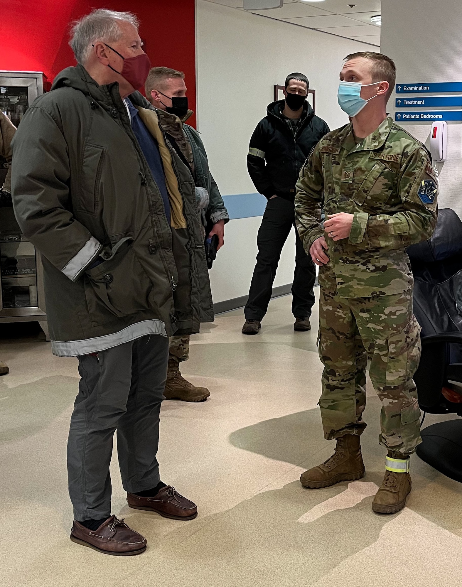 Secretary of the Air Force Frank Kendall, left, is briefed by U.S. Air Force Tech. Sgt. Asa Stansbury, 821st Support Squadron, at the medical clinic on Thule Air Base, Greenland, Feb. 11, 2022. Stansbury highlighted the clinics capabilities in support of Airmen, Guardians, contractors, local villages and remote scientific research facilities in northern Greenland.