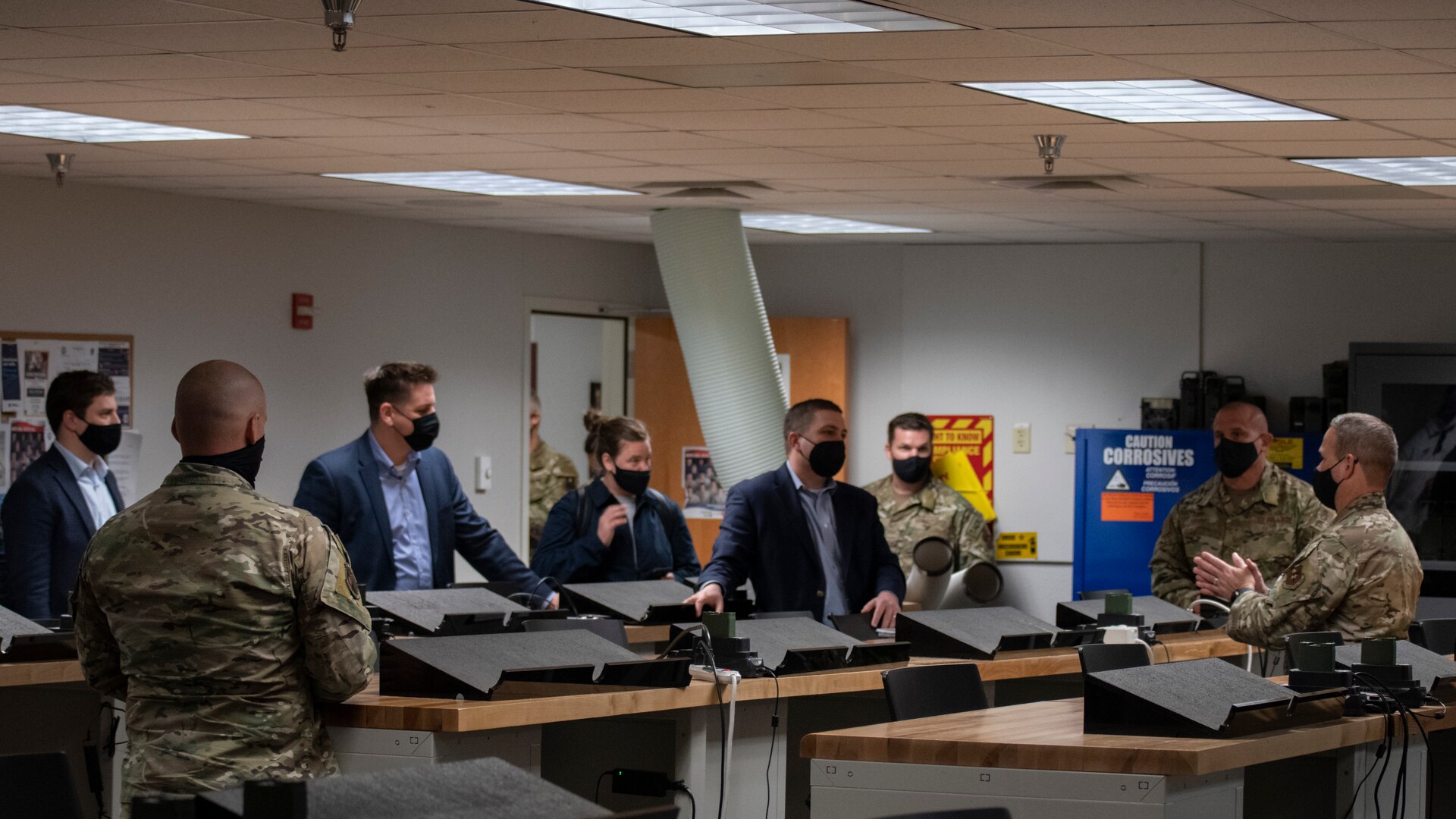 Lt. Col. Matthew McMurtry, 353rd Special Warfare Training Squadron commander (far right), briefs a delegation of U.S. Senate staff members from across the United States on the Tactical Air Control Party training pipeline on Joint Base San Antonio-Chapman Training Annex, Texas, Feb. 23, 2022. The delegation visited the Special Warfare Training Wing to learn more about Air Force Special Warfare and the unique capabilities AFSPECWAR operators bring to the battlefield.