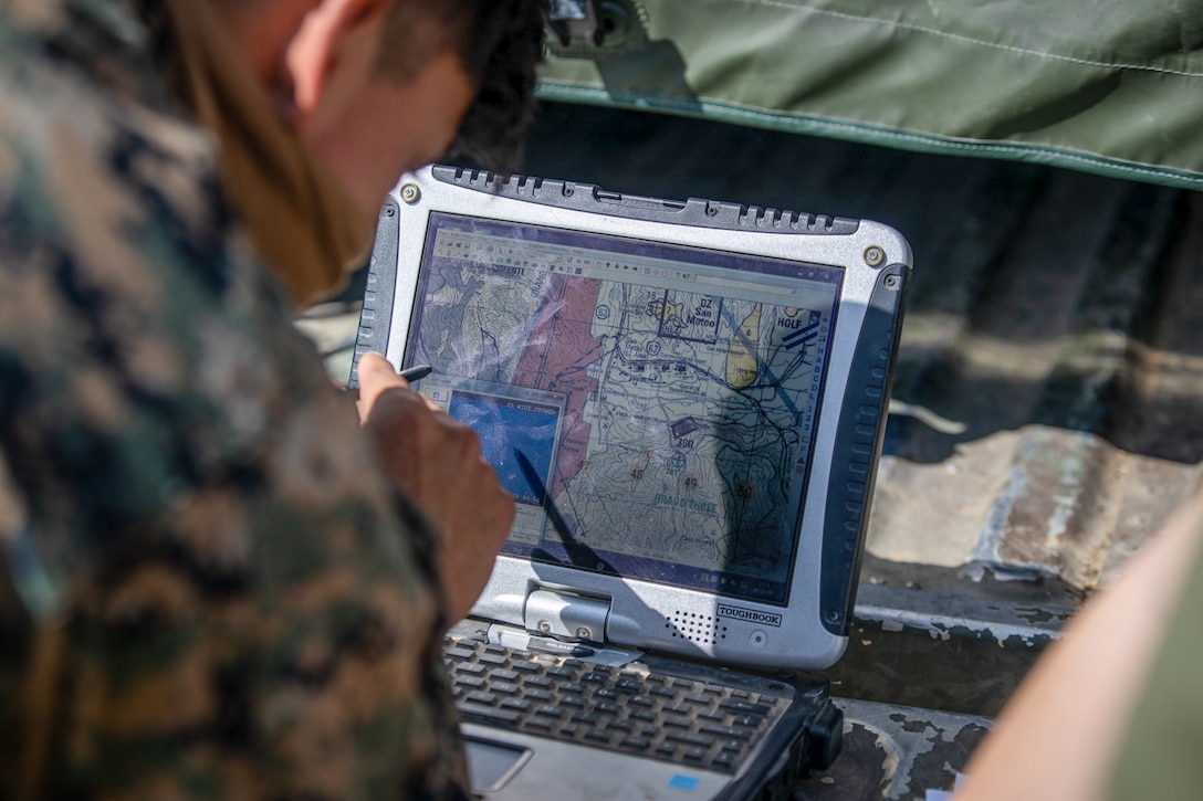 U.S. Marine Corps Sgt. Ediberto Ponce, an intelligence chief with Headquarters Battery, 11th Marine Regiment, 1st Marine Division, tracks an RQ-20B Puma on a laptop during a training exercise at Marine Corps Base Camp Pendleton, California, Sept. 21, 2020. The Marines conduct routine flight hours in order to maintain flight currency with the Puma, and must qualify on the system every 30 days. (U.S. Marine Corps photo by Lance Cpl. Isaac Velasco)