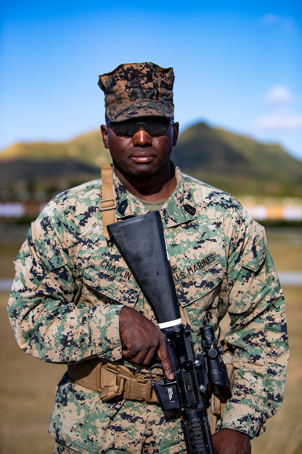 U.S. Marine Corps Master Sgt. Marc Chaplin, a base range noncommissioned officer in charge  with  Headquarters and Support Battalion, Marine Corps Installations Pacific, poses for a portrait during the Marine Corps Marksmanship Competition Far East on Camp Hansen, Okinawa, Japan, Dec. 9, 2021. During the competition, Marines practiced marksmanship on multiple courses of fire while conducting advanced pistol and rifle movement drills to accumulate scored points as a team and as individuals. The Marines with a score in the top 10 percentile will receive a medal and advance to other competitions. The competition is held annually to improve Marines’ marksmanship fundamentals, combat readiness, and proficiency with both rifle and pistol. (U.S. Marine Corps photo by Lance Cpl. Jonathan Beauchamp)