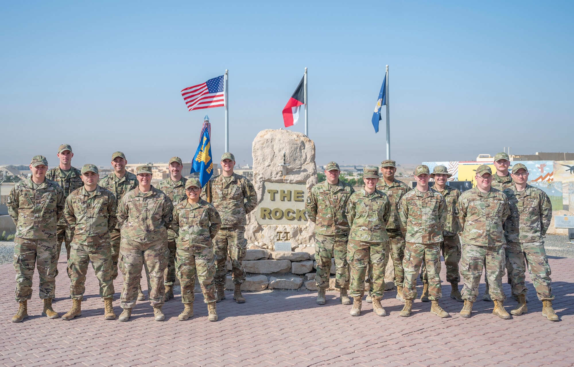 The 386th Expeditionary Contracting Squadron pose for a photo