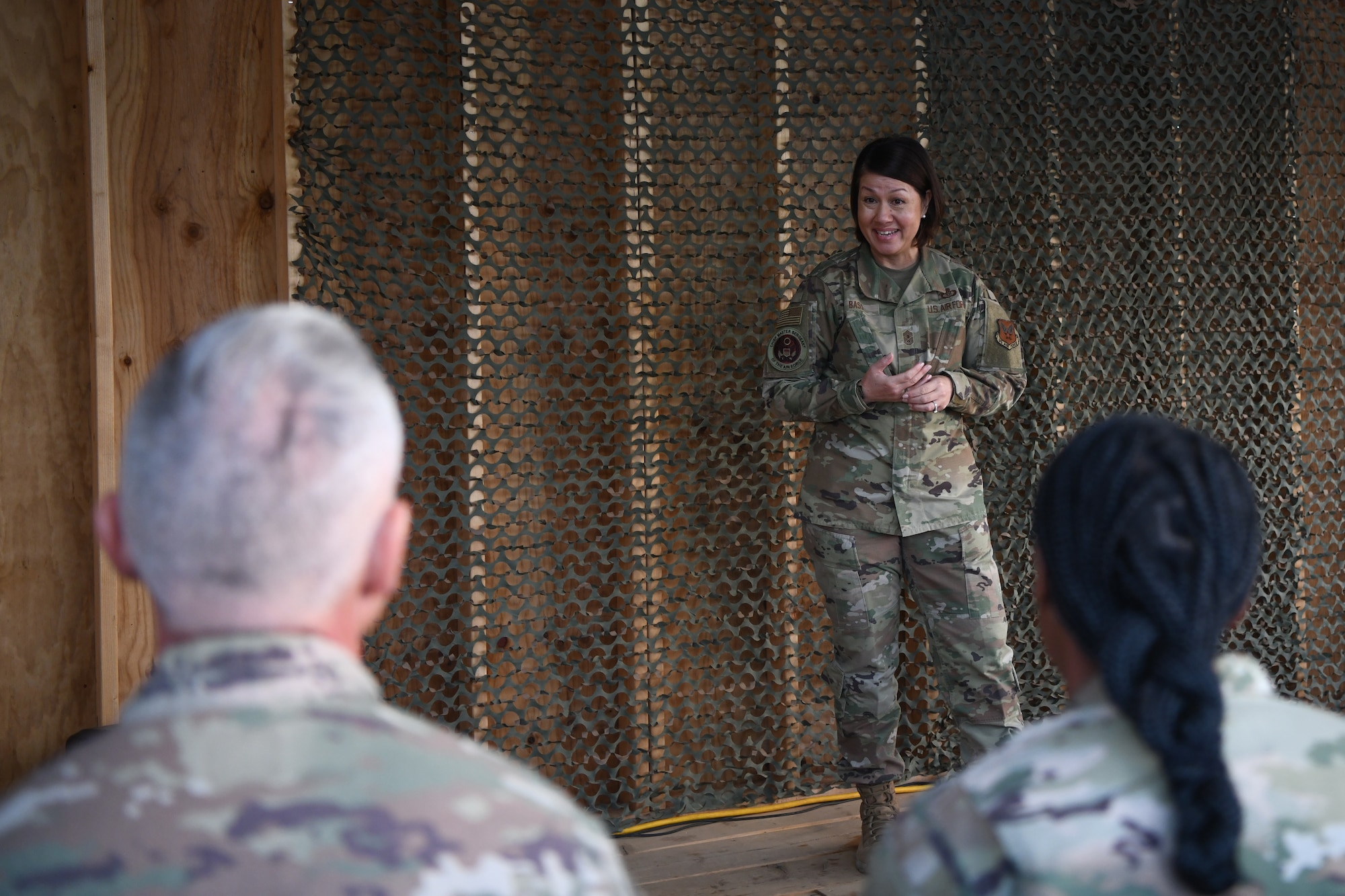 Chief Master Sgt. of the Air Force JoAnne S. Bass speaks to approximately 50 Airmen during an all-call at Nigerien Air Base 101, Niamey, Dec. 22, 2021. During her visit to AB 101, Bass addressed the importance of how the U.S. Air Force must develop and build a deep intuitive understanding of our strategic competitors, and reward and retain Airmen who foster the personal attributes necessary for success. (U.S. Air Force photo by Senior Airman Ericka A. Woolever)