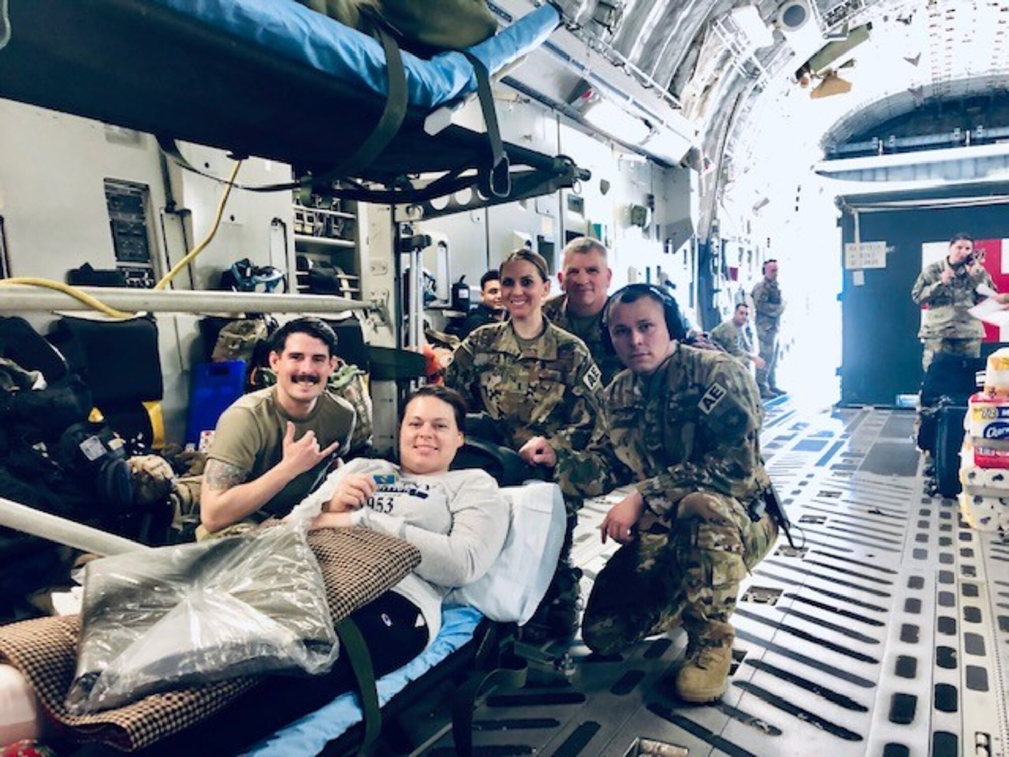 Airmen post on an airplane