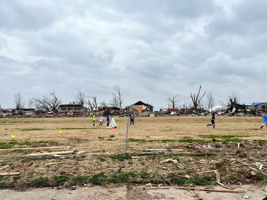 The residents of Mayfield are beginning to start the healing process after the Kentucky Tornados. Here, they are scanning the fields and cleaning up debris together.