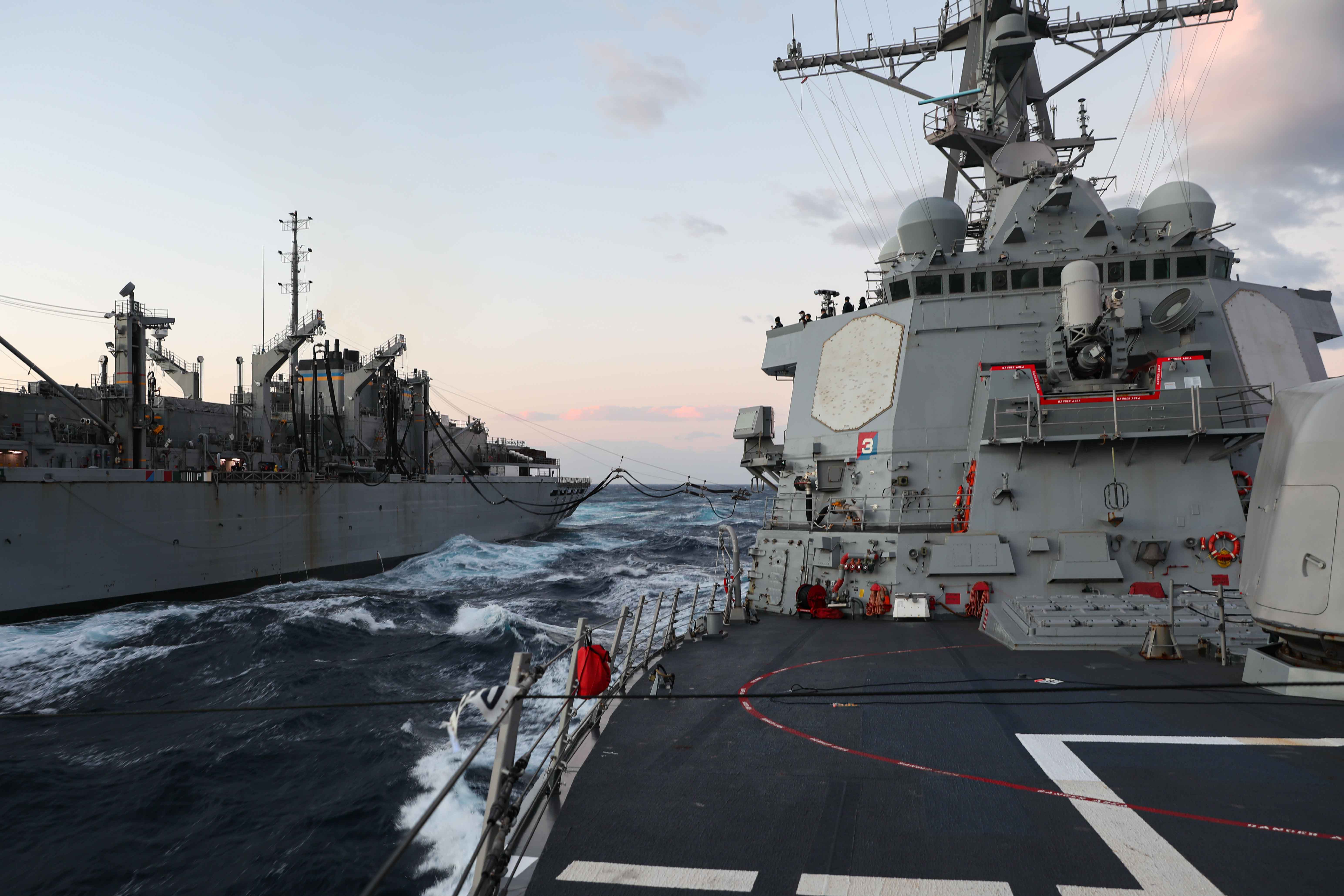 The Arleigh Burke-class guided-missile destroyer USS Ross (DDG 71), right, receives fuel from the fast combat support ship USNS Supply (T-AOE 6) during a replenishment-at-sea in the Mediterranean Sea.