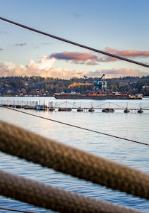 Crane 79 begins its journey to Portsmouth Naval Shipyard in Kittery, Maine, via barge, from Puget Sound Naval Shipyard & Intermediate Maintenance Facility, Nov. 20, 2021. (U.S. Navy photo by Wendy Hallmark)