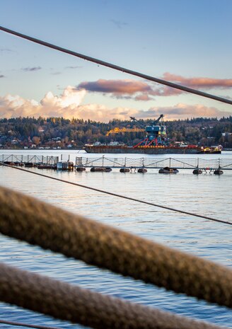 Crane 79 begins its journey to Portsmouth Naval Shipyard in Kittery, Maine, via barge, from Puget Sound Naval Shipyard & Intermediate Maintenance Facility, Nov. 20, 2021. (U.S. Navy photo by Wendy Hallmark)