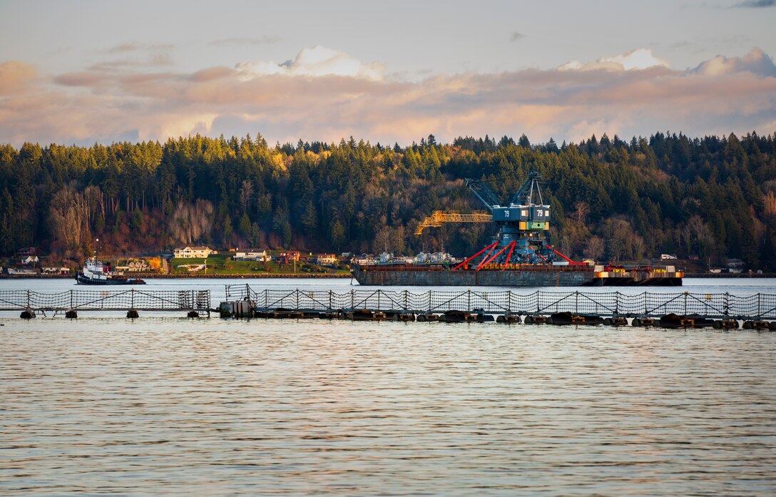 Crane 79 begins its journey to Portsmouth Naval Shipyard in Kittery, Maine, via barge, from Puget Sound Naval Shipyard & Intermediate Maintenance Facility, Nov. 20, 2021. (U.S. Navy photo by Wendy Hallmark)