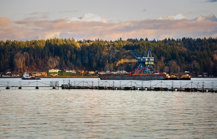 Crane 79 begins its journey to Portsmouth Naval Shipyard in Kittery, Maine, via barge, from Puget Sound Naval Shipyard & Intermediate Maintenance Facility, Nov. 20, 2021. (U.S. Navy photo by Wendy Hallmark)