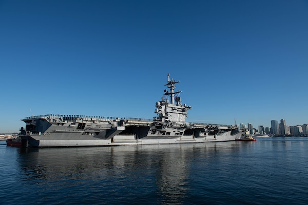 SAN DIEGO (Jan. 3, 2022) - Nimitz-class aircraft carrier USS Abraham Lincoln (CVN 72) transits San Diego bay for a regularly-scheduled deployment.  (U.S. Navy/MC1 Kelby Sanders)