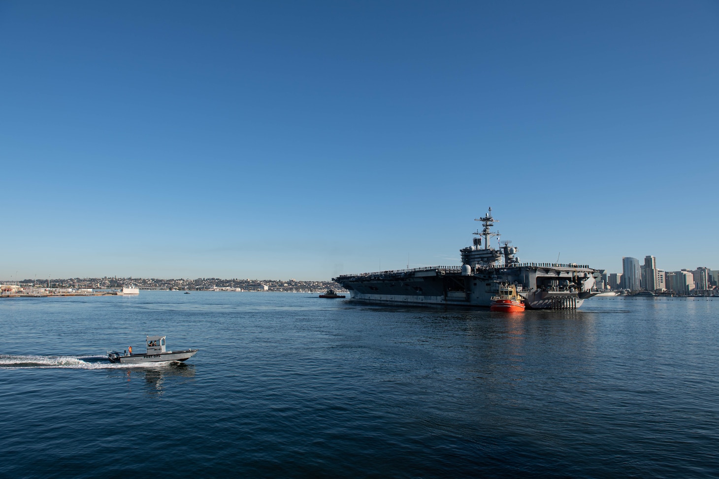 SAN DIEGO (Jan. 3, 2022) - Nimitz-class aircraft carrier USS Abraham Lincoln (CVN 72) transits San Diego bay for a regularly-scheduled deployment. (U.S. Navy/MC1 Kelby Sanders)
