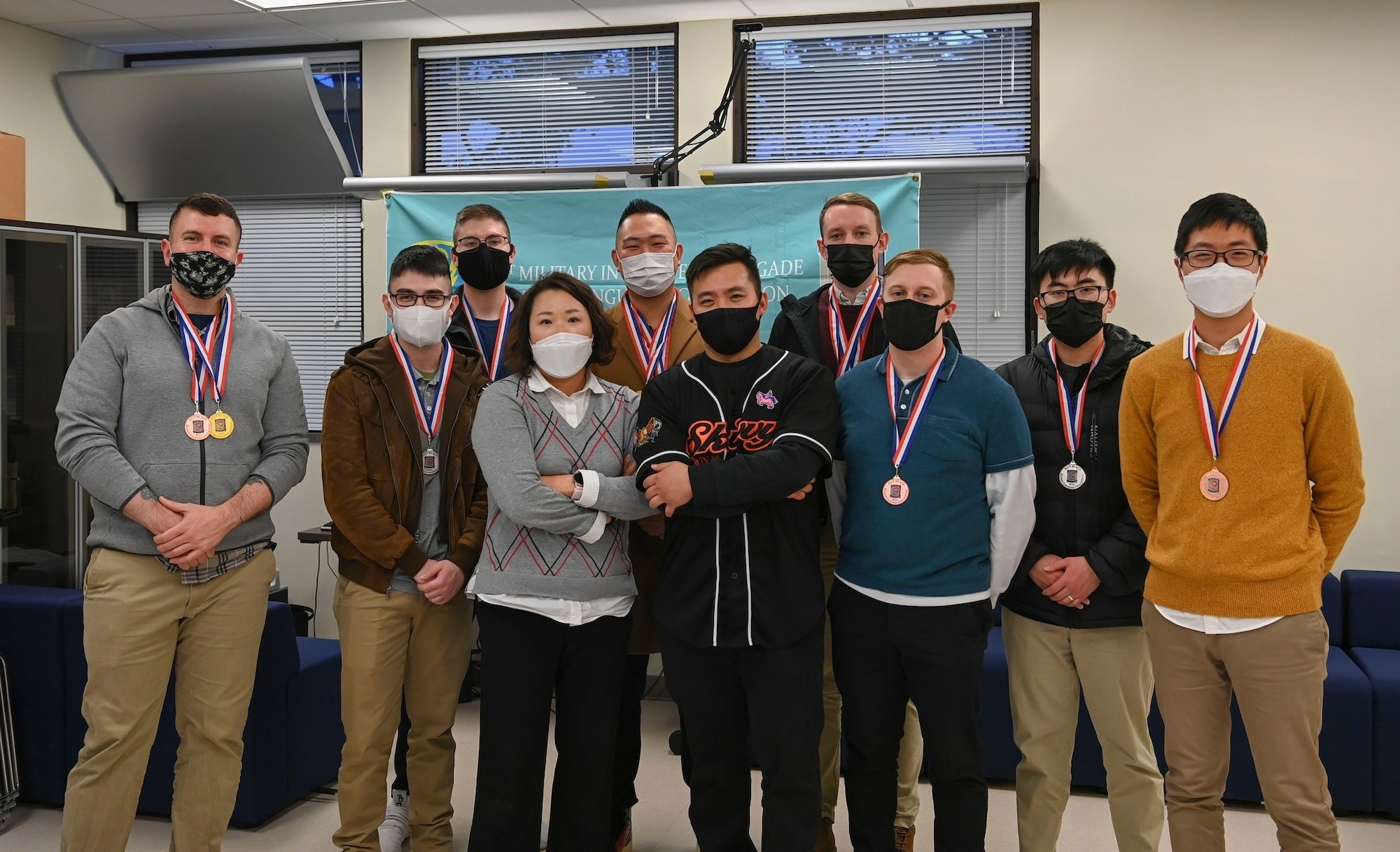 Participants of the 9th annual Korean language competition pose for a photo December 3, 2021, at U.S. Army Garrison Camp Humphreys, Republic of Korea. The Air Force took home nine of the 12 medals and won overall. (U.S. Air Force photo by Senior Airman Nicole Molignano)