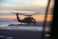 (File photo) Alaska Army National Guardsmen from 1st Battalion, 207th Aviation Regiment, conduct an aerial site survey via a UH-60 Black Hawk helicopter Dec. 3, 2018, following a magnitude 7.0 earthquake seven miles from Joint Base Elmendorf-Richardson on Nov. 30 caused significant infrastructure damage in a number of areas. (U.S. Army National Guard photo by Balinda O’Neal)