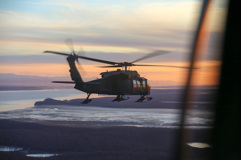 (File photo) Alaska Army National Guardsmen from 1st Battalion, 207th Aviation Regiment, conduct an aerial site survey via a UH-60 Black Hawk helicopter Dec. 3, 2018, following a magnitude 7.0 earthquake seven miles from Joint Base Elmendorf-Richardson on Nov. 30 caused significant infrastructure damage in a number of areas. (U.S. Army National Guard photo by Balinda O’Neal)