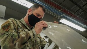 U.S. Air Force Staff Sgt. Matt Hicks looks over the integrity of the fastners on an F-35 panel at the 388th MXS Squadron at Hill Air Force Base.