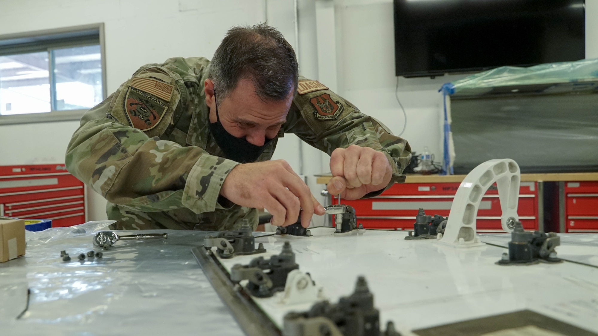 U.S. Air Force Staff Sgt. Matt Hicks repairs a low observable panel at the 388th MXS Squadron at Hill Air Force Base