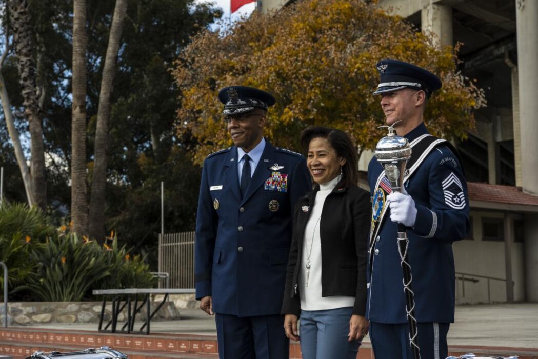 Air Force Chief of Staff Gen. CQ Brown, Jr., his wife, Sharene, and Chief Master Sgt. Daniel Valadie, U.S. Air Force Total Force Band drum major, take a promotional photo together before the Tournament of Roses Parade and Rose Bowl Dec. 31, 2021, in Pasadena, Calif. America’s Air Force participated in America’s New Year Celebration to kickoff 2022 and the yearlong celebration of the 75th anniversary of the Department of the Air Force. (U.S. Air Force photo by Nicholas Pilch)