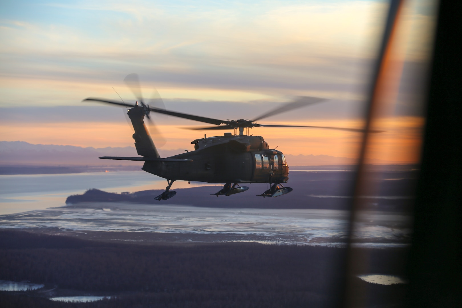 File photo of Alaska Army National Guardsmen from 1st Battalion, 207th Aviation Regiment, conducting an aerial site survey via a UH-60 Black Hawk helicopter Dec. 3, 2018.