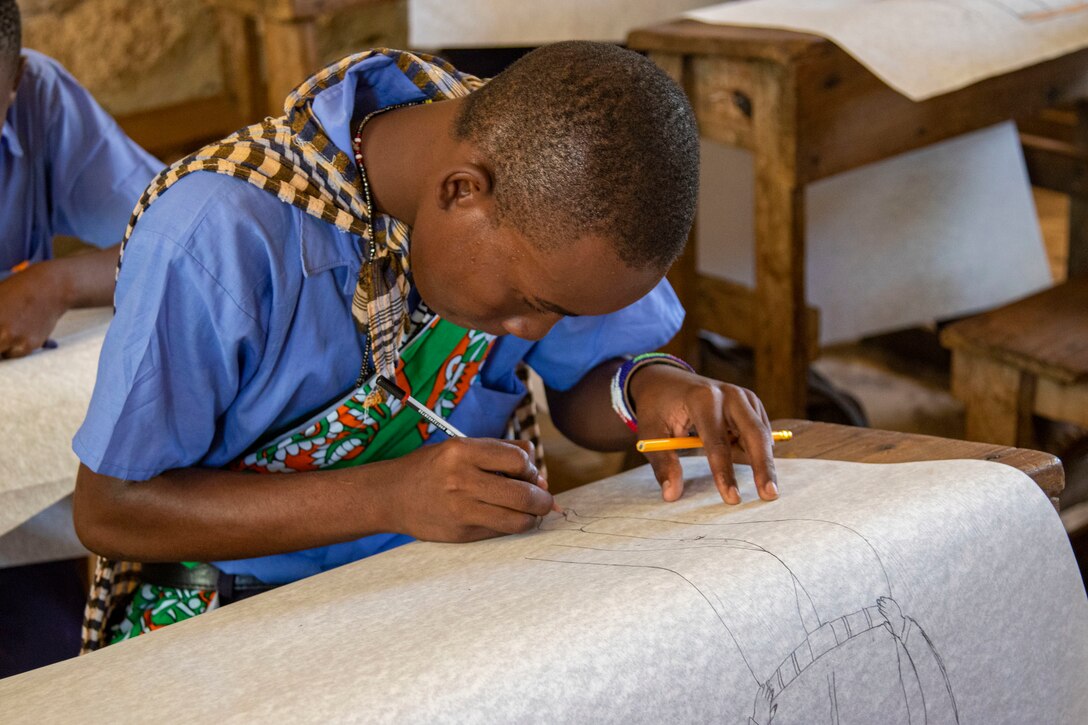 Students at a local school in Lamu County, Kenya, draw on art supplies donated by Soldiers from the 404th Civil Affairs Battalion (Airborne), Civil Affairs East Africa, during a cultural engagement, Nov. 2, 2021. CJTF-HOA’s efforts, as part of a comprehensive whole-of-government approach, are aimed at increasing African partner nations’ capacity to maintain a stable environment, with an effective government that provides a degree of economic and social advancement to its citizens.