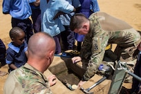 U.S. Army Sgt. 1st Class Shawn Danaher and Sgt. Quinton Banus, both with B Company, 572nd Brigade Engineer Battalion, Task Force Iron Gray, Combined Joint Task Force – Horn of Africa (CJTF-HOA), replaces the rubber seals on a kiosk water meter at a school in Lamu County, Kenya, Nov. 2, 2021. CJTF-HOA’s efforts, as part of a comprehensive whole-of-government approach, are aimed at increasing African partner nations’ capacity to maintain a stable environment, with an effective government that provides a degree of economic and social advancement to its citizens.