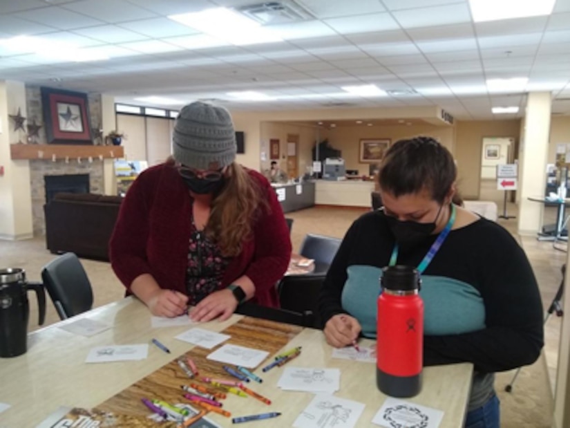 Members of the Fort Riley Soldier Recovery Unit (SRU) in Kansas help fill boxes of toys that will be sent to children in Mexico.