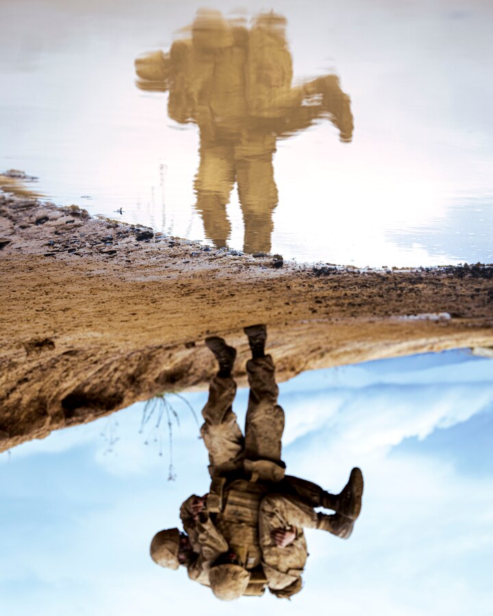 A U.S. Marine Corps recruit with Alpha Company, 1st Recruit Training Battalion, carries his fellow recruit to the next challenge of an obstacle course on Marine Corps Base Camp Pendleton, California, Dec. 29, 2021. This event was a segment of the crucible – the culminating event of recruit training. After completing the crucible’s physically and mentally demanding challenges over the course of 54-hours with limited food and sleep, the recruits will finally have the privilege to call themselves United States Marines. Bellow-Cope was recruited out of Dallas, Texas with Recruiting Station Killeen. (U.S. Marine Corps photo by Sgt. Christopher A. Madero)