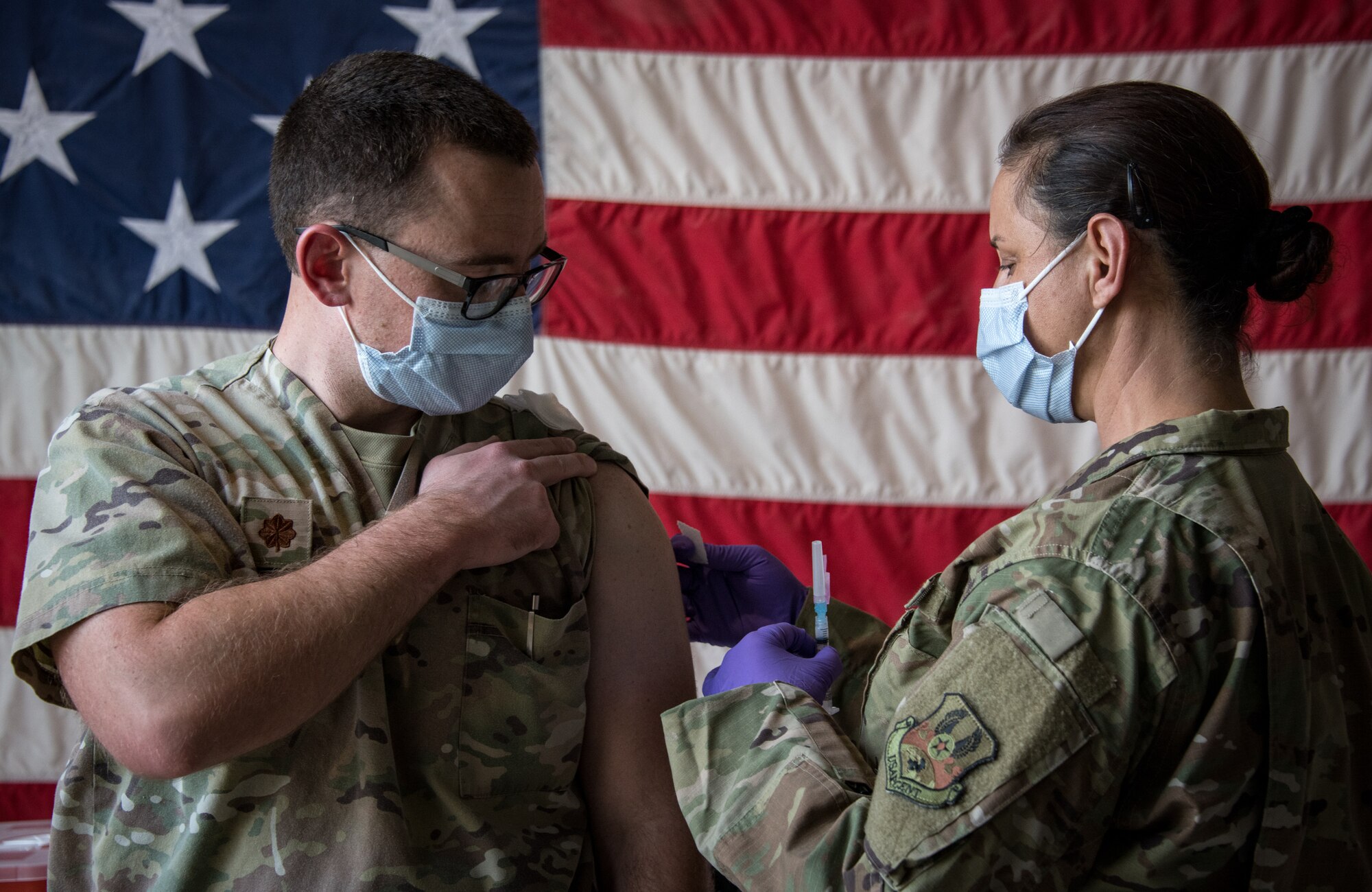 A photo of an airman receiving a vaccine
