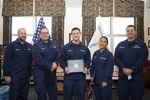 U.S. Coast Guard Reservists pose for a group photo at a recognition ceremony, here, Dec. 17, 2021. The group was being recognized for their facilitation and performance in the Coast Guard Academy's COVID Testing Program, administering approximately 45,000 COVID tests in 2021. (U.S. Coast Guard photo by Petty Officer 3rd Class Matthew Abban)
