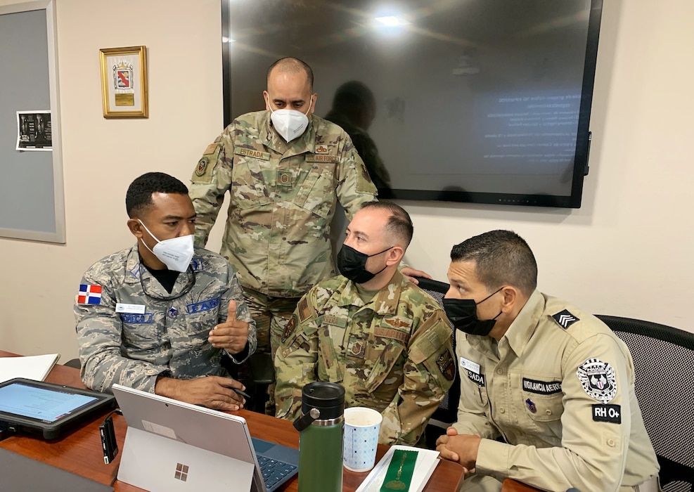 Master Sgt. Renier Herrera, Air National Guard member and student at the Inter-American Air Forces Academy, listens to a classmate